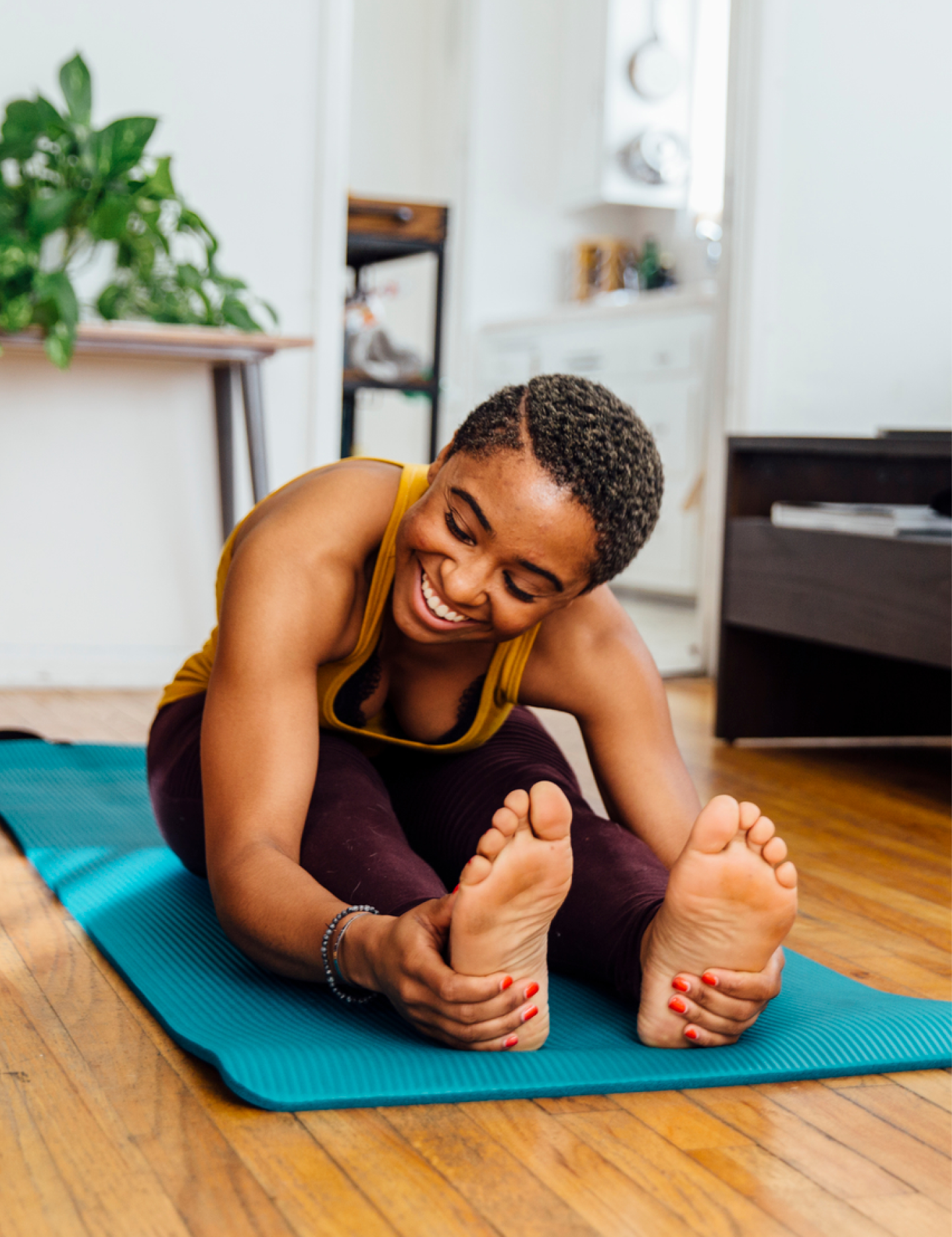 Beautiful black woman doing yoga | HŌM Wellness